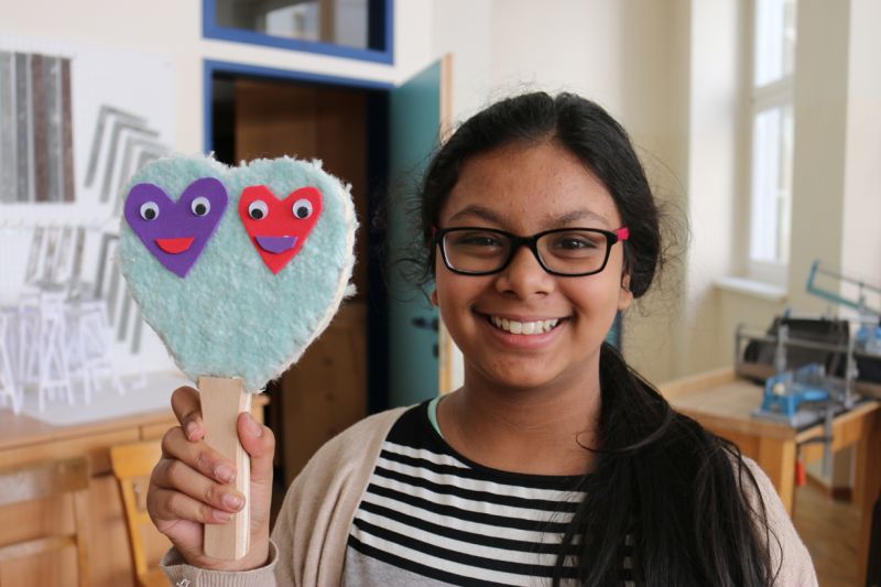 Girl with self-made ping pong racket